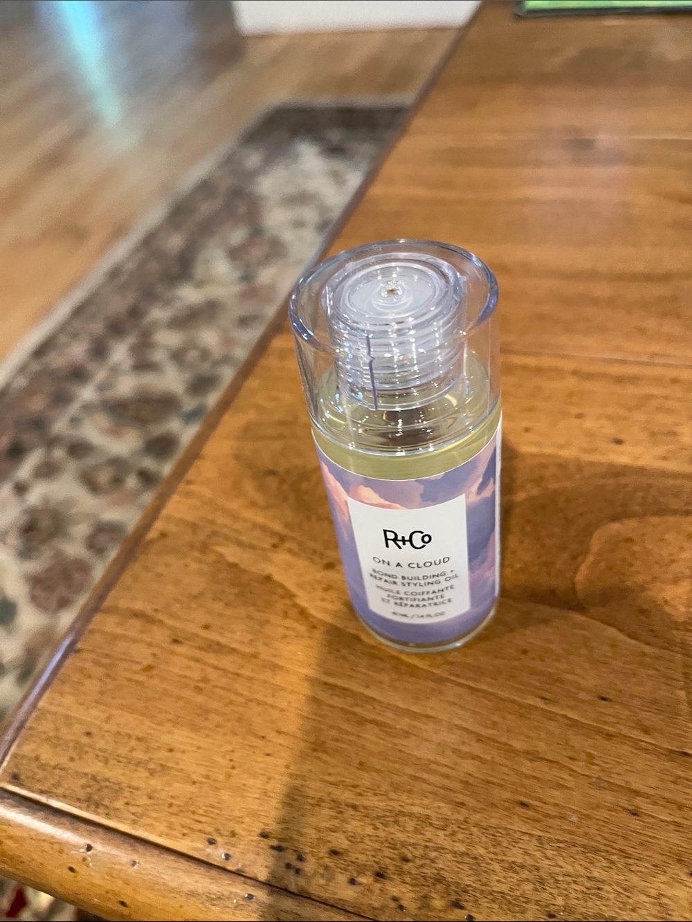 R+Co On A Cloud Styling Oil - Purple and White Bottle